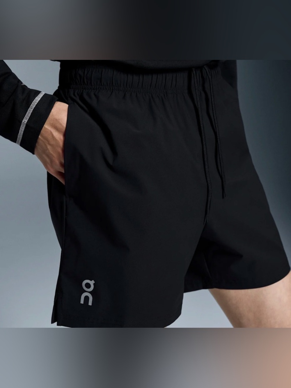 On Running Black Athletic Shorts with Reflective Logo